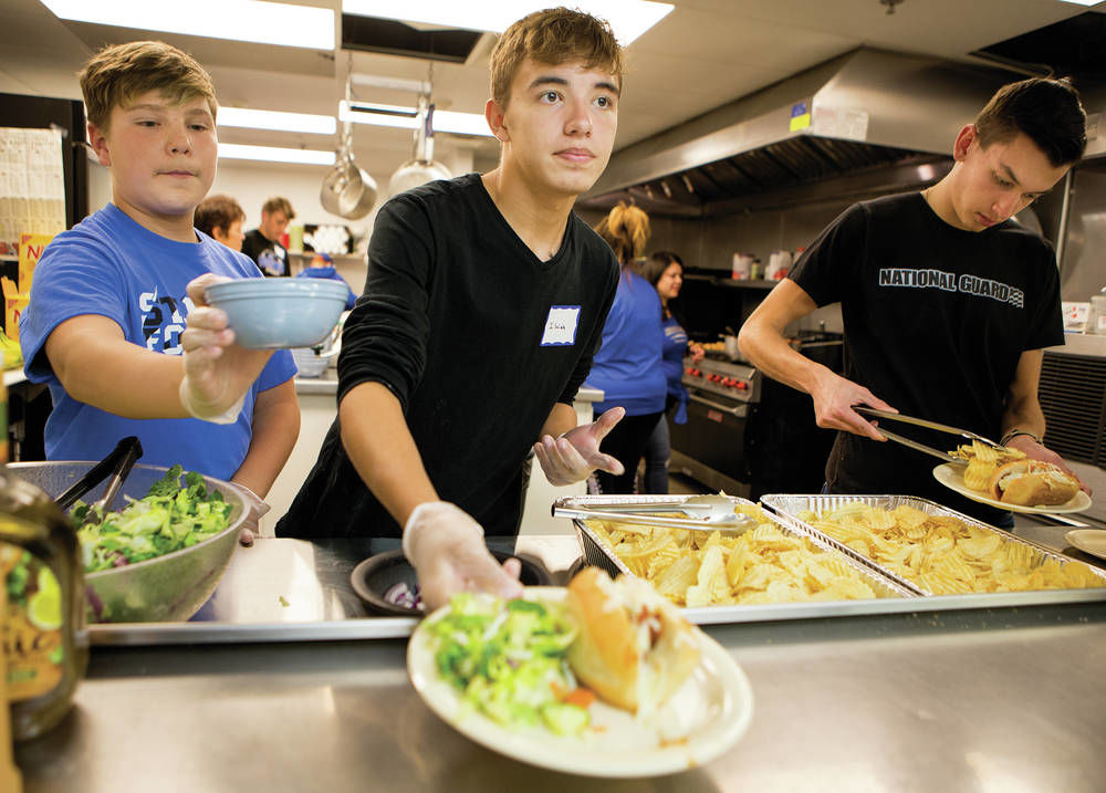 At shelter, St. Michael’s football players get a lesson in service